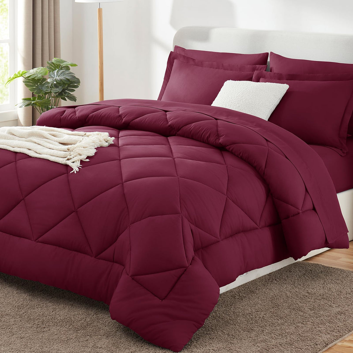 CozyLux queen comforter set Burgundy in vacuum packaging for easy storage.