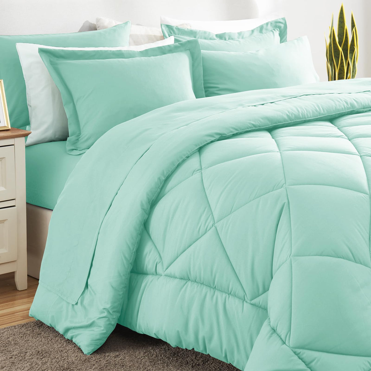 CozyLux mint-green pillowcases complement the set beautifully