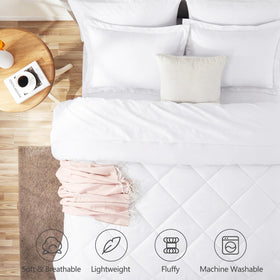Close-up of CozyLux fabric reveals plush down-alternative fill and smooth texture.