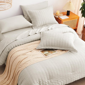 CozyLux vacuum-sealed packaging keeps bedding compact and easy to store.