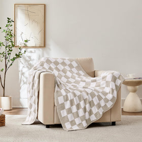 Cozzenity plaid blanket on bed adds decor and comfort