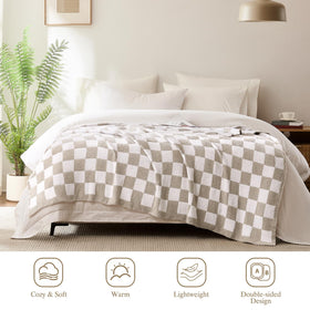 Cozzenity checkered throw blanket draped over sofa for stylish warmth