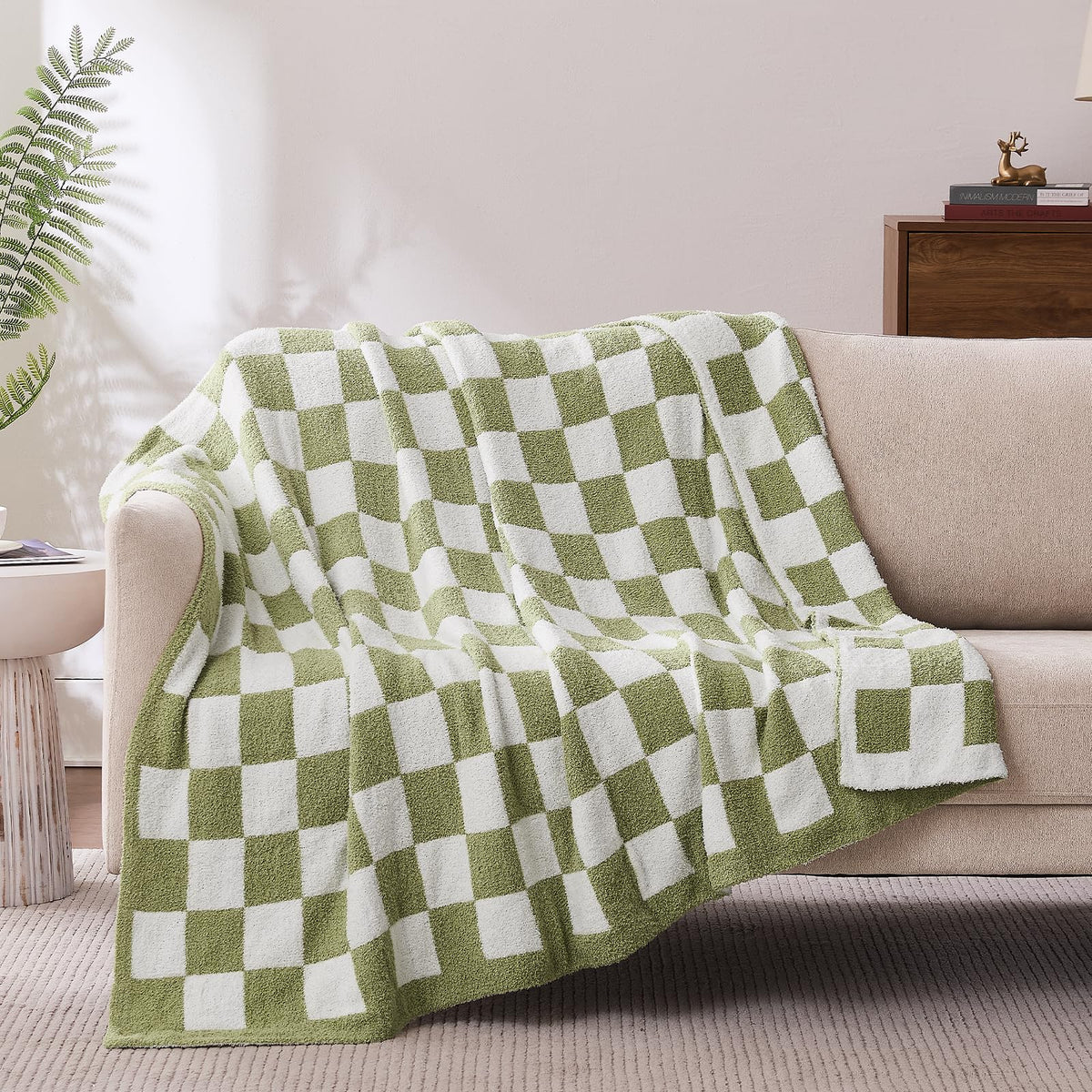 Cozzenity checkered throw in sage green on a sofa adds cozy warmth and style