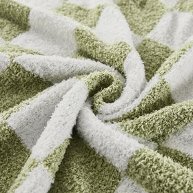 Cozzenity sage green checkered throw used for a picnic with light warmth