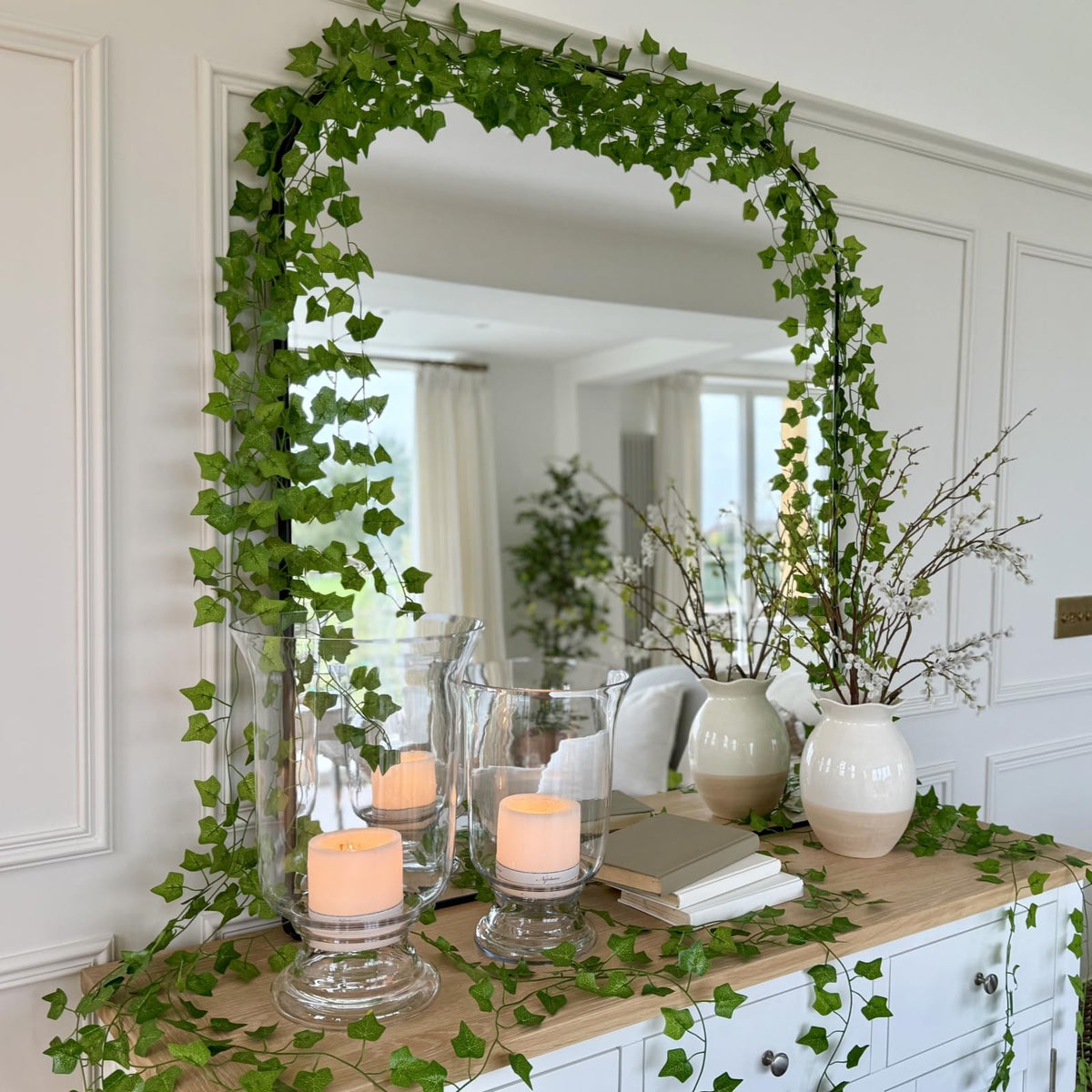 CQURE ivy garland on wall decor for dramatic simple setup.