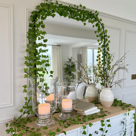 CQURE ivy garland on wall decor for dramatic simple setup.