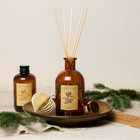 Amber glass vase from Craft & Kin protects oil while adding warmth
