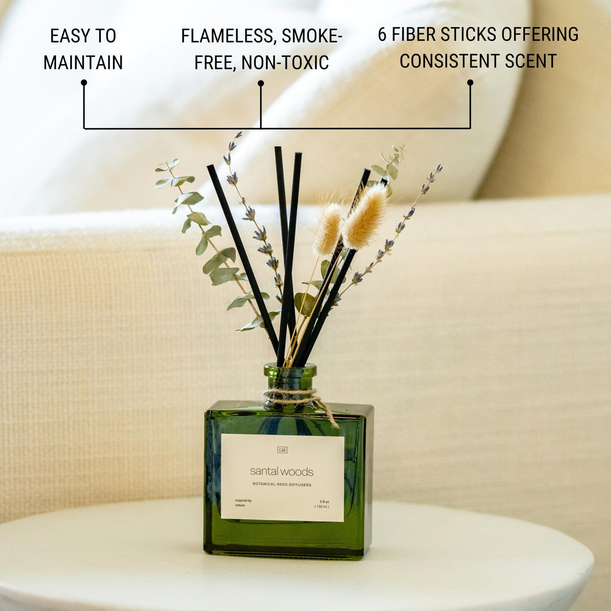 Craft & Kin reed diffuser placed in a living room enhancing the calm fragrance.