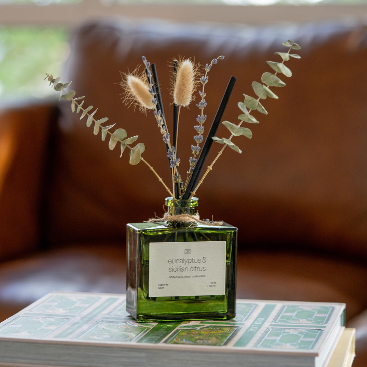 Craft & Kin green glass diffuser bottle complements modern decor with lasting fragrance