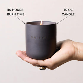 Lit Craft & Kin Santal Woods candle in cozy ambiance shot