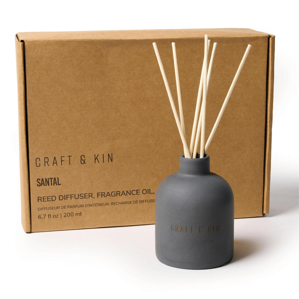 Craft & Kin Santal Woods reed diffuser bottle delivering warm, lasting fragrance for cozy spaces.
