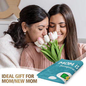Craftique mom blanket on sofa nap emphasizes warmth and lightweight comfort.