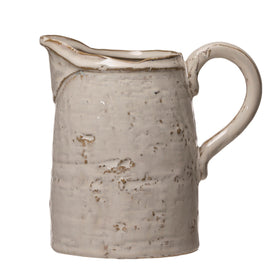 Creative Co-Op pitcher shows naturally varying finish, adding table character.