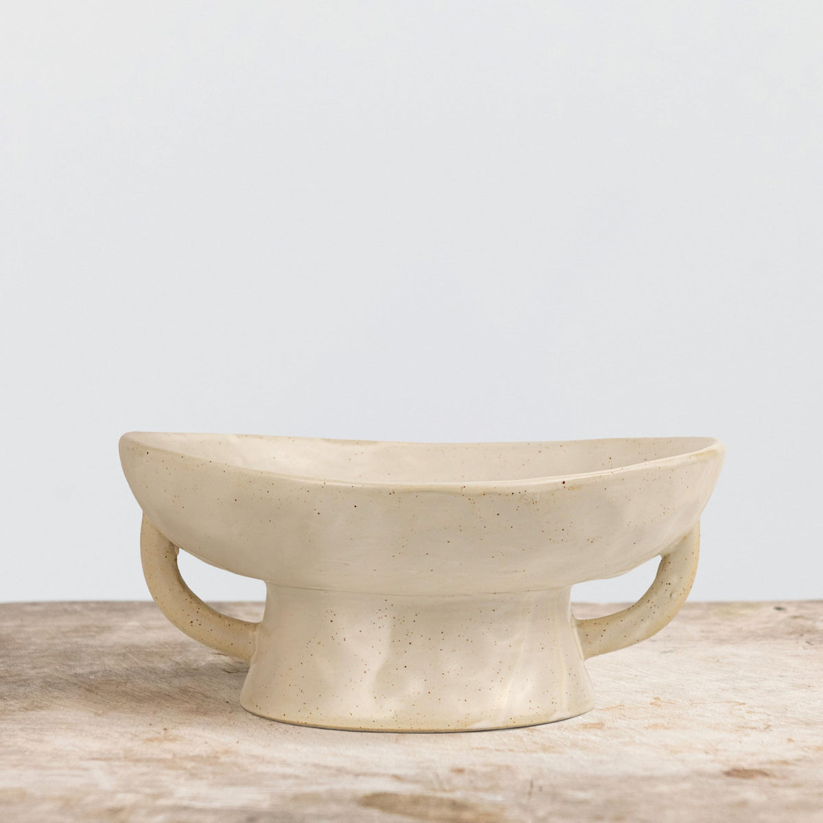 Creative Co-Op bowl on a shelf elevating decorative elements