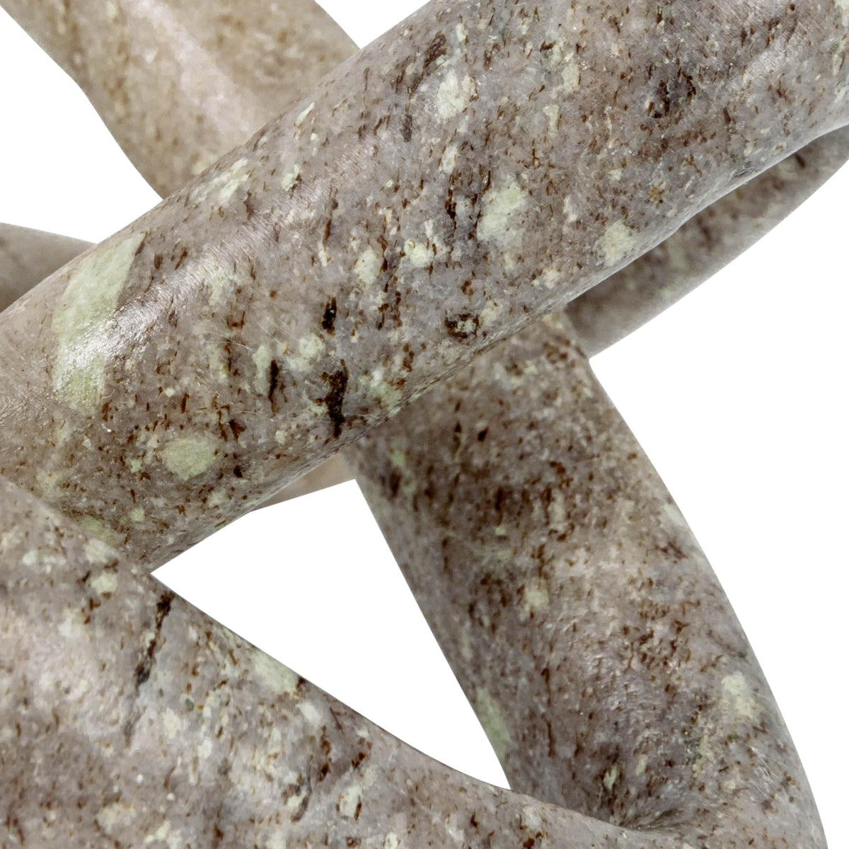 Beige marble link knot on coffee table as focal point
