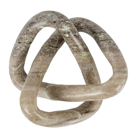 Beige marble knot on console table with soft lighting