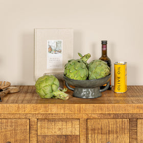 Creative Co-Op pedestal bowl with handles set up for casual entertaining