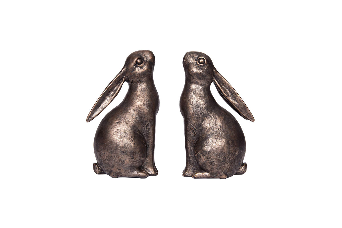 Creative Co-Op bronze rabbit bookend side view supports large books on rustic shelves.