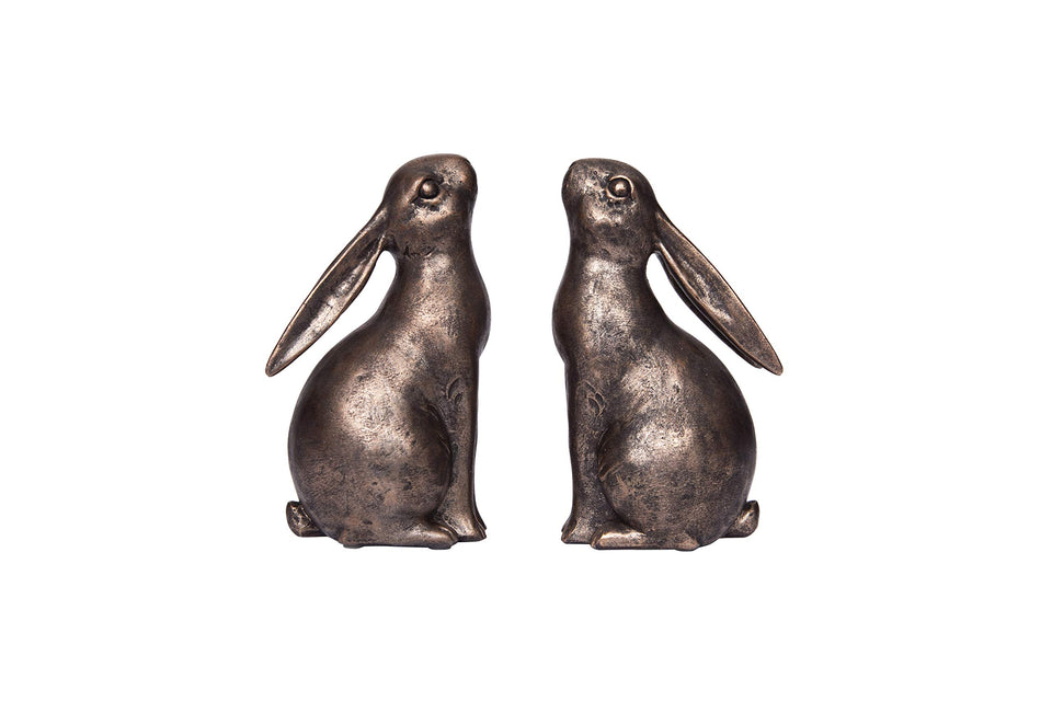 Creative Co-Op bronze rabbit bookend side view supports large books on rustic shelves.