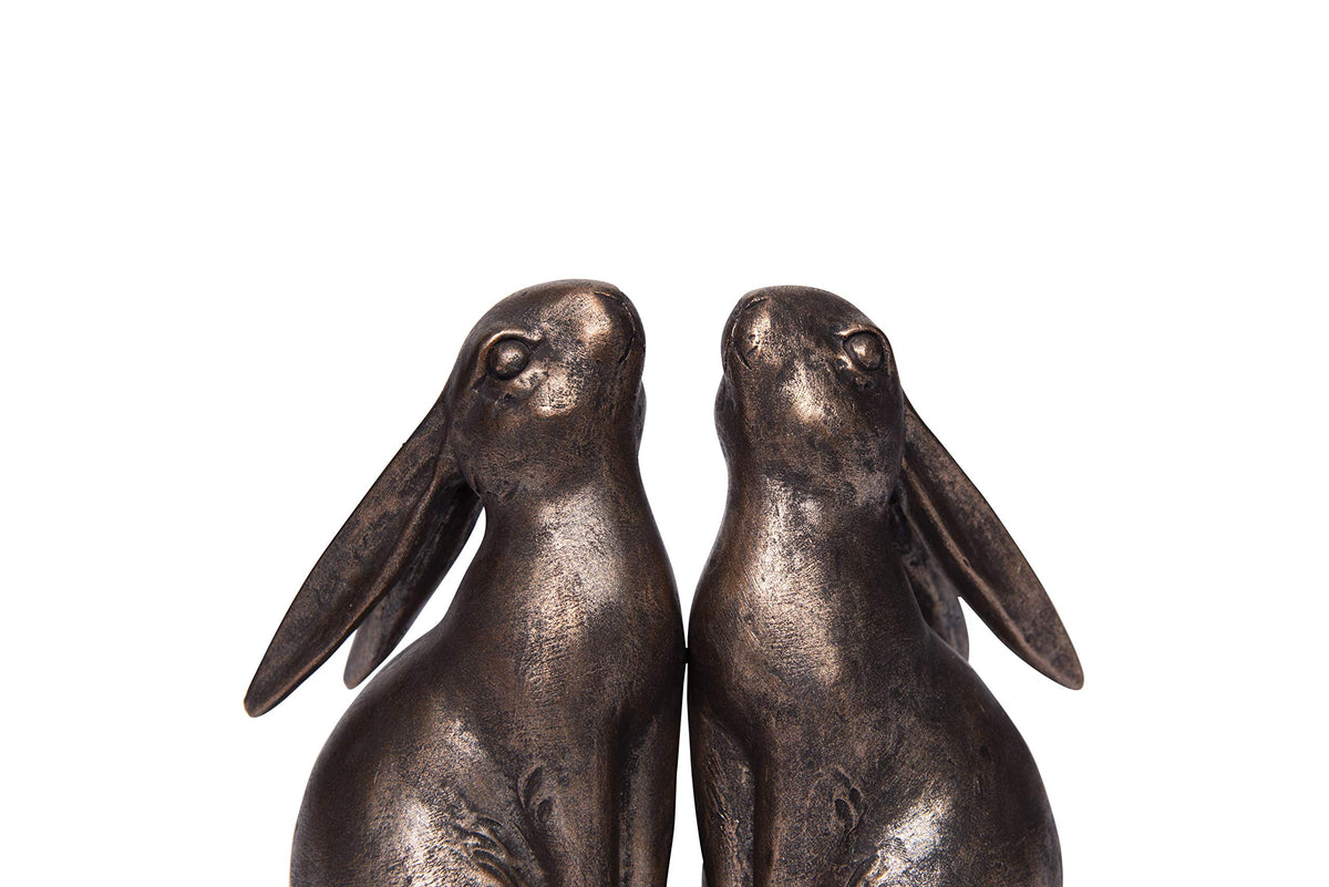 Creative Co-Op rabbit bookends on desk organize kids' books and notebooks.