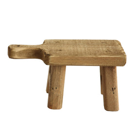 Creative Co-Op rustic pedestal supports figurines, creating a mini-gallery on a console