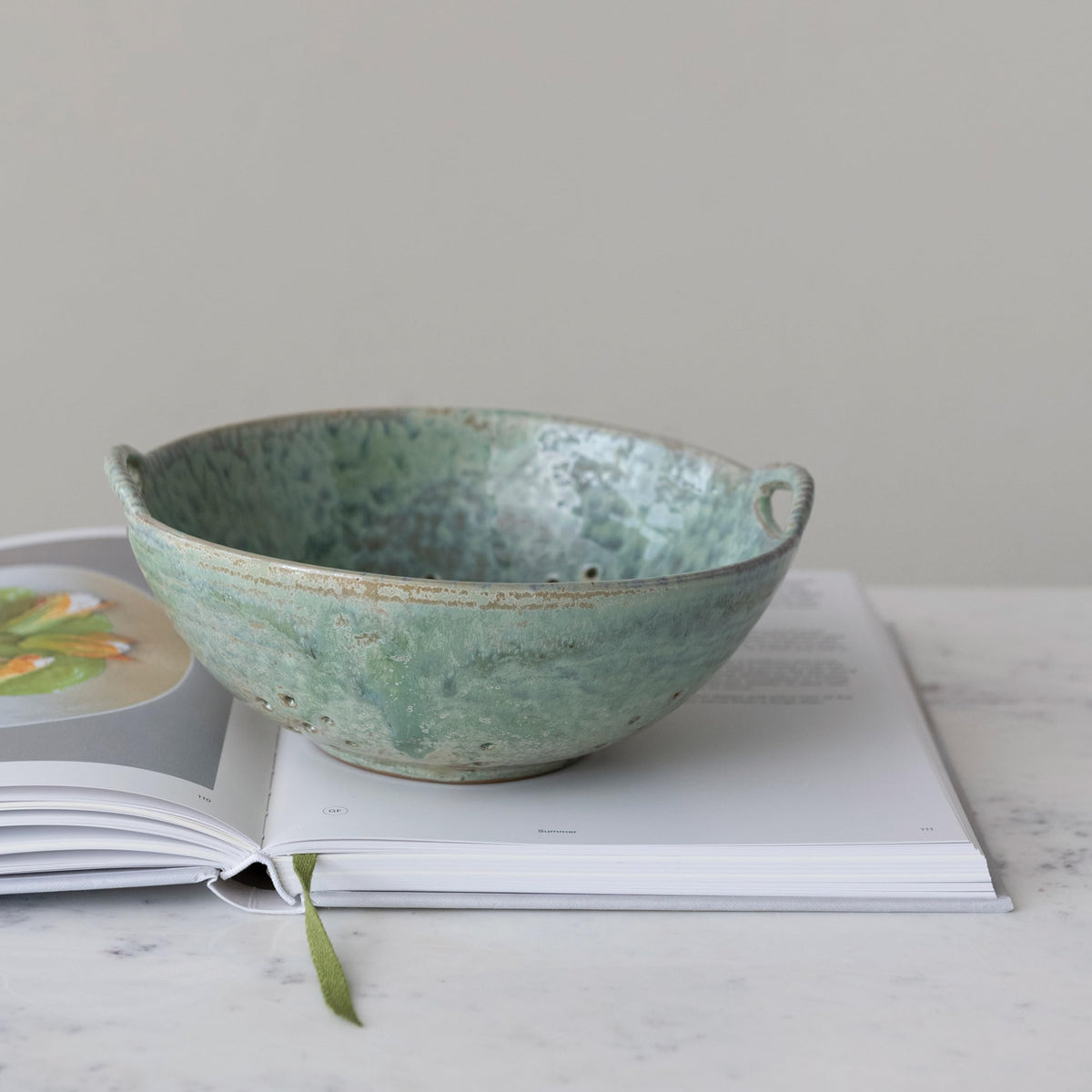 Creative Co-Op berry bowl, aqua glaze closeup highlights rich glaze variations and rustic texture.