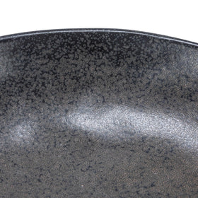 Stoneware bowl with sculptural base for dried botanicals.
