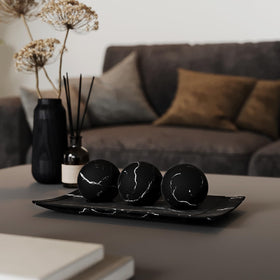 Creative Scents Black Marble Orb Set adds dimension to the display.