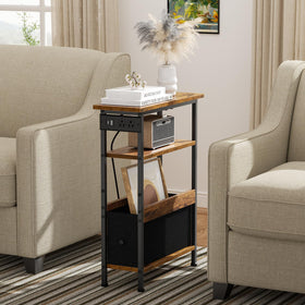 Creso hom slim table showing charging station powering devices at bedside.