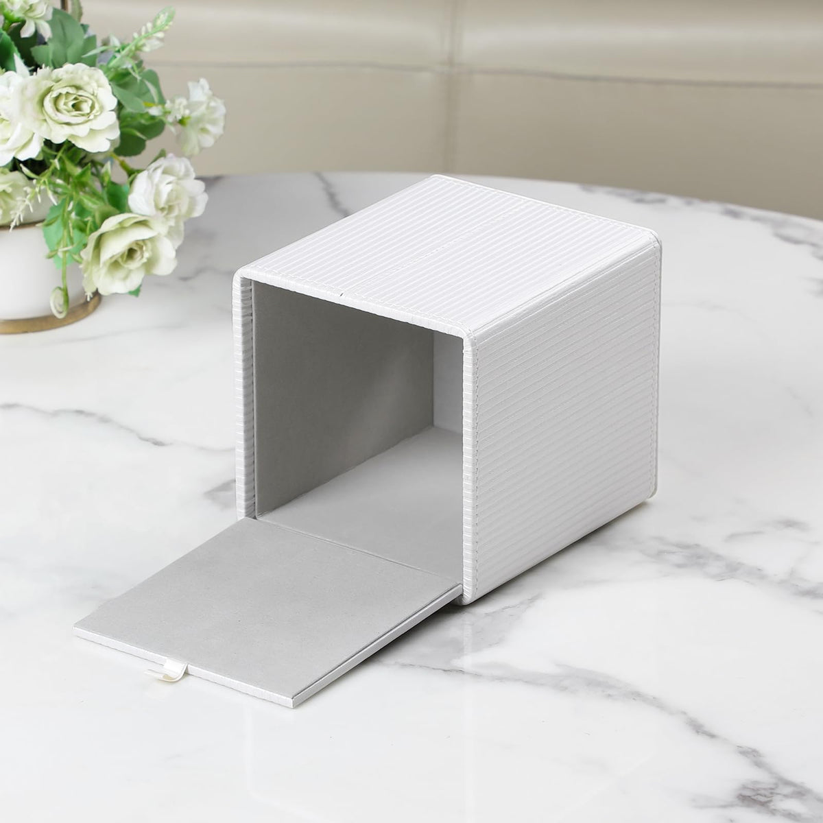 Cretkhp PU leather tissue holder enables easy refill and secure magnetic bottom.