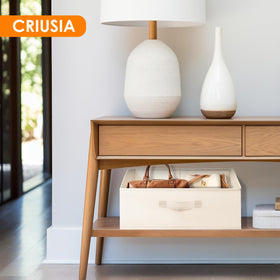 Criusia closet bins in bedroom with towels and clothes organized
