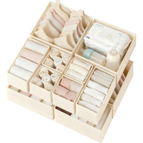 Criusia beige drawer organizer 12-pack in nursery setup keeps clothes neatly sorted.