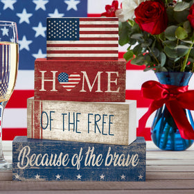 CroBlissful seven-piece patriotic decor set enhances seasonal arrangements.