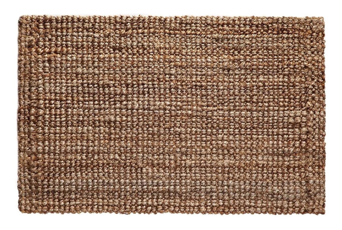 Croft&Cane handspun jute rug in warm tan adds natural texture to living spaces.
