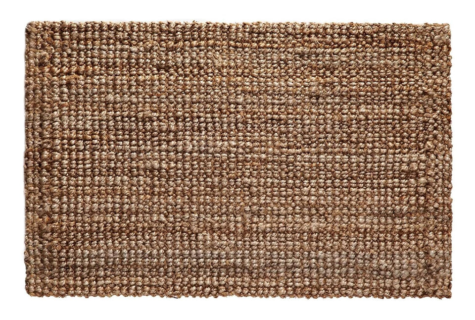 Croft&Cane handspun jute rug in warm tan adds natural texture to living spaces.