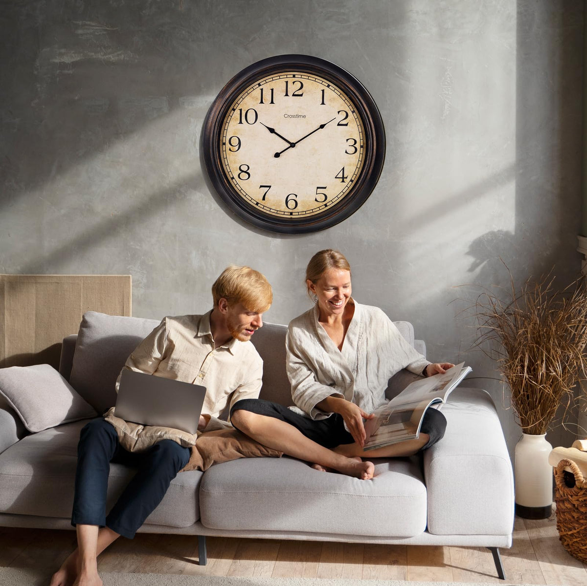 Crosstime 24-Inch clock enhances living room decor with a vintage touch.