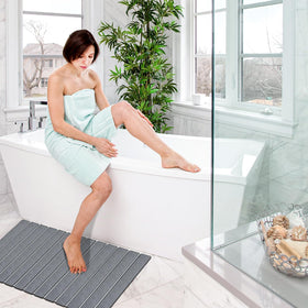 Cuckan shower mat protects tub and doorway from moisture.