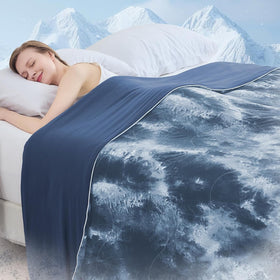 Cushious cooling comforter on bed demonstrates cooling design for hot sleepers.