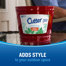 Cutter Candle on a deck adding warmth and ambiance to the space.