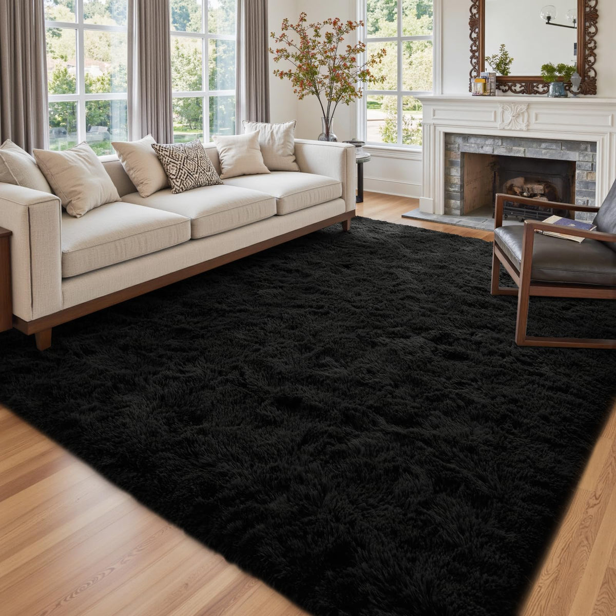 Cuzwlovita 6x9ft black shag rug adds cozy focal point to the living room.