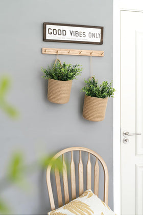 Dahey farmhouse boho wall decor in rustic brown tones.