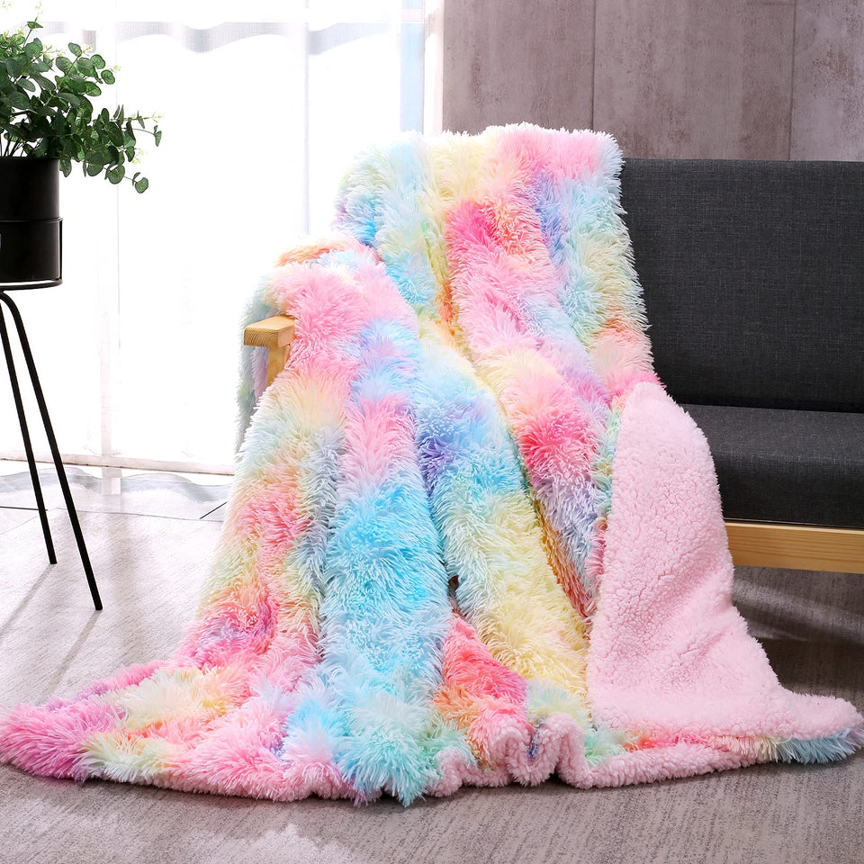 Dangtop fuzzy faux fur throw blanket in rainbow tie-dye adds cozy color and warmth.