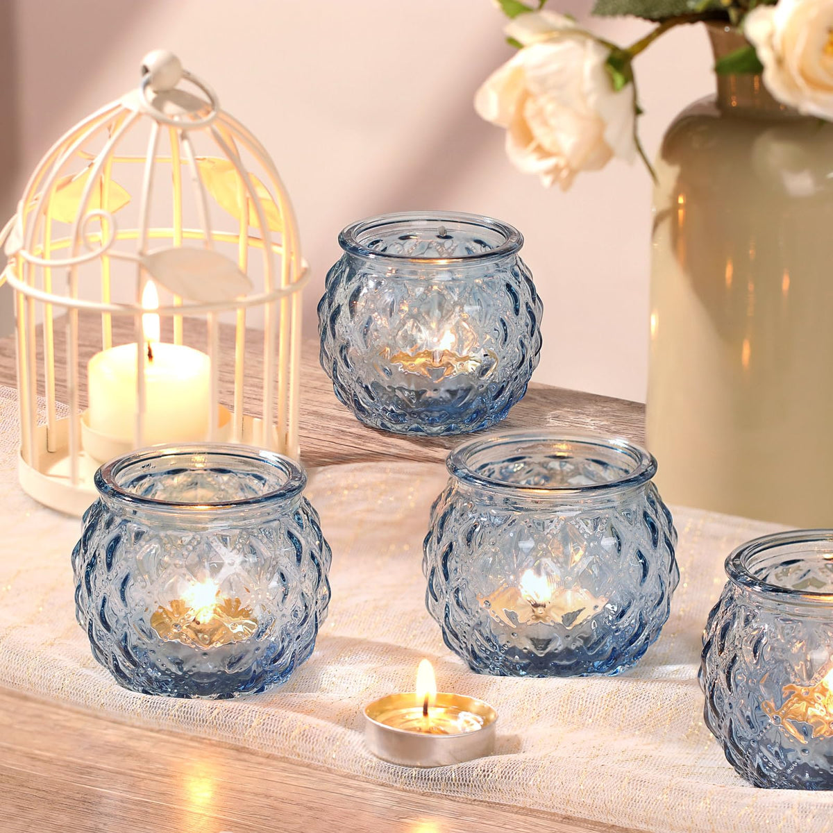 DARJEN 24-pack blue votives ready for elegant centerpiece setups.