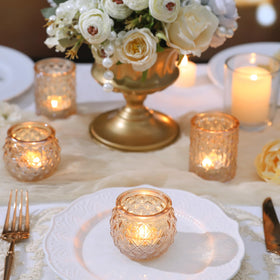 DARJEN glass votives reflect candlelight, adding cozy ambiance.