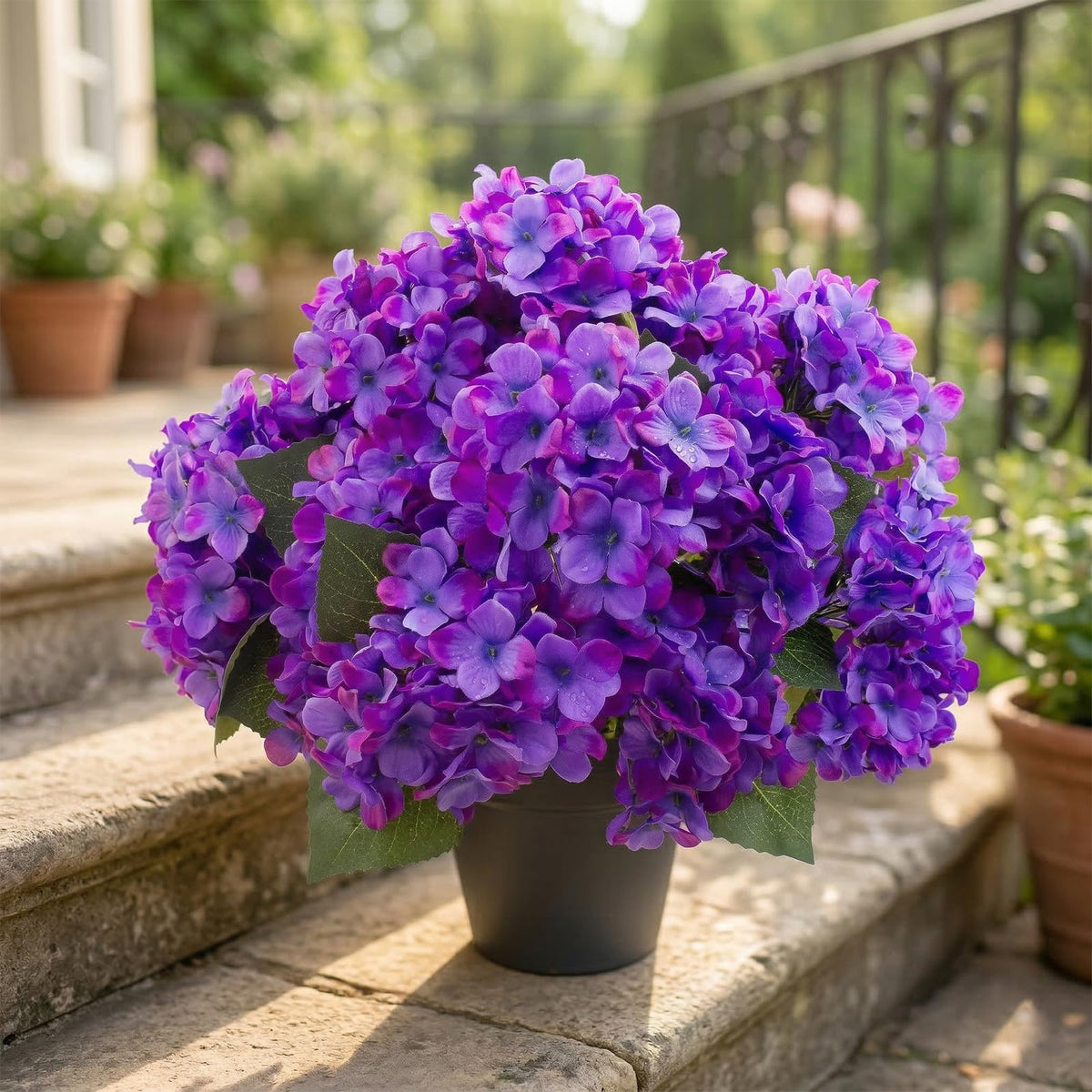 Daynight hydrangea outdoor silk bouquet set against greenery, photo-friendly.