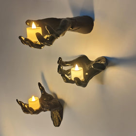 DAZONGE wall-mounted Halloween hands with candles create eerie ambience.