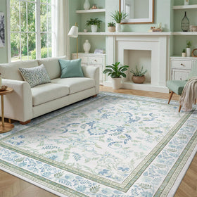 DCX Green 6x9 rug with ivory base and botanical florals enhances living room ambience.