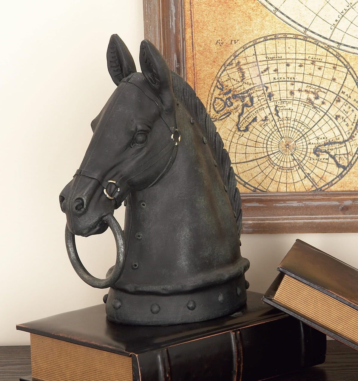 Deco 79 black matte finish sculpture rests on a stable base.