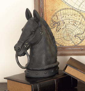 Deco 79 black matte finish sculpture rests on a stable base.