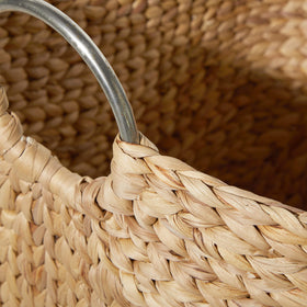 Deco 79 handcrafted seagrass basket offers stylish organization and easy relocation